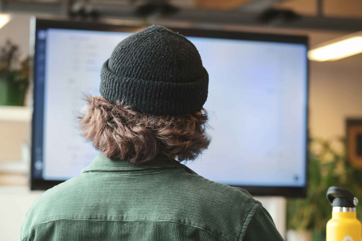 Cyber security analyst in front of computer screen